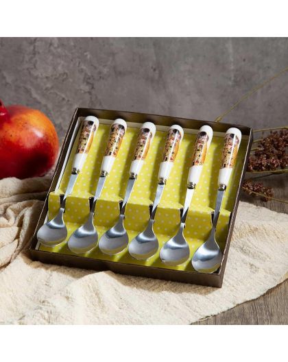 Set of teaspoons "The Kiss" series on a gold background
