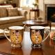 Set of two gift cups with spoons, The Kiss, gold and black – 280 ml