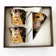 Set of two gift cups with saucers and spoons – The Kiss in black and gold – 180 ml